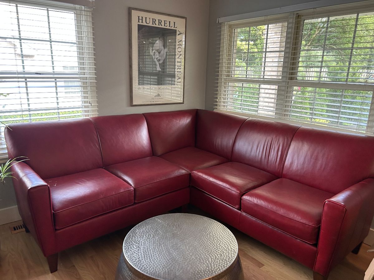 Stunning leather sofa from Beidleman’s Furniture measure is 83 inches from corner to end on each side comes apart in two pieces for convenient moving