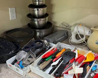 Mixer, electric knife, storage bowls, roaster, lots of utensils 