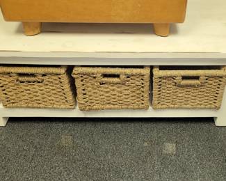 White coffee table with wicker baskets