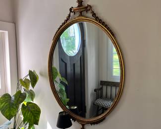OVAL FRAME MIRROR WITH URN & DRAPE
Gilt wood frame 