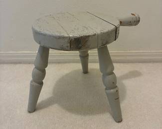 Vintage three-legged milking stool with handle