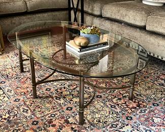 vintage brass and glass oval coffee table on beautiful rug - 9x12