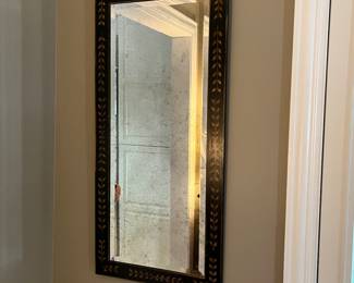 wall mirror with black and gold frame