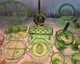 Uranium/Vaseline glass.  Some rare pieces.  I have never seen the vintage salts before and all twelve come with their spoons.