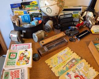 S & H green stamps, vintage pencil sharpeners, cardboard postcards. office supplies, table lamps, globe...