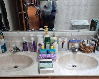 Second bathroom filled with toiletries,