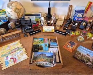 Postcards of many different sizes, glass paperweights, tape dispensers...
