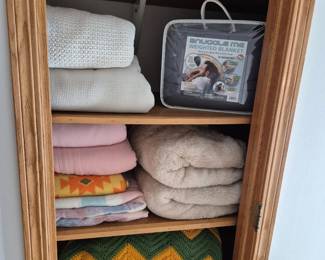As we make our way up a few stairs you will find we removed the door to the linen closet so no one misses the cozy blankets ready for the nice cool weather.