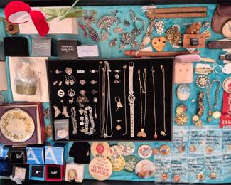 I'm taking you on a tour of the house as I would go...  First stop would be the jewelry.  The entire dinning room table with the leaves and the buffet are full.  In this case the black center has 14K, 10K, Sterling and an Elizabeth Taylor watch.