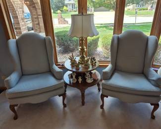 Matching, comfy wing back chairs with a great two tiered table.