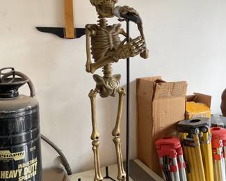 small skeleton with mic- about 3’ tall