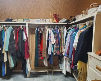 Large closet full of women's clothing, shoes and purses 