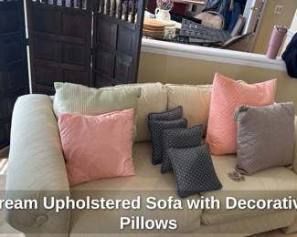 Cream Upholstered Sofa with Decorative Pillows 