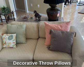 Cream Upholstered Sofa with Decorative Pillows 