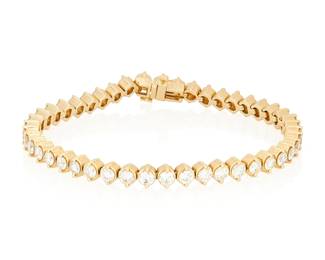 137
A Gold and Diamond Bracelet
Featuring forty-six round diamonds weighing approximately 6.90 carats

Length: 7 in.
15.9 grams gross
Estimate: $2,500 - $3,500