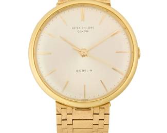 308
Patek Philippe: An 18K Gold Watch
Dial: 30.00 mm, round with baton hour markers
Case: 35.00 mm
Closure: 18k gold link bracelet with adjustable clasp closure
Signed: dial with box and papers

Inner circumference: 7 - 7 1/2 in.
78.4 grams gross
Estimate: $12,000 - $18,000