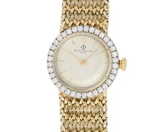 281
Baume Mercier: A 14K Gold and Diamond Watch
Dial: 19.40 mm, round with baton hour markers, encircled by single-cut diamonds weighing approximately 0.72 carat
Case: 23.90 mm
Case number: 304404, 36586
Closure: woven gold bracelet with a jewelry clasp
Signed: dial

Inner circumference: 7 in.
49.0 grams gross
Estimate: $1,200 - $1,800
