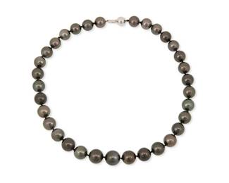 156
A 14K White Gold and Tahitian Cultured Pearl Necklace
A single strand of graduated gray and black cultured pearls measuring approximately 12.03 - 14.40 mm, finished with a 14k white gold clasp

length: 18 in.
96.5 grams gross

Accompanied by a GIA Report numbered #5231659337, dated August 9, 2025, stating the pearl as Cultured Saltwater Pinctada margaritifera, Natual Color, no treatment
Estimate: $2,000 - $3,000
