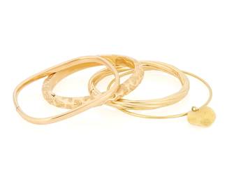 173
Four Gold Bangles
Three of a hinged design, the other suspending a gold charm
4 pieces

Measures: 6 1/2 - 8 in.
72.3 grams gross
Estimate: $2,500 - $3,500