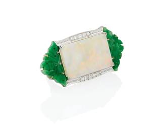 68
A Platinum, Jadeite Jade and Opal Ring
Centering a rectangular opal tablet accented by two carved jadeite jade elements, and finished with round diamonds

Size: 6 1/4
19.1 grams gross

Accompanied by a GIA Report numbered #2231625991, dated July 14, 2025, stating the Jadeite as natural with no dye or impregnation detected - 'A' jade.
Estimate: $1,500 - $2,000