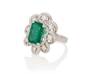 265
A Platinum, Emerald and Diamond Ring
Centering a rectangular step-cut emerald weighing approximately 4.50 carats, accented by swirling loops of round diamonds weighing approximately 2.15 carats

Size: 7
15.1 grams gross
Estimate: $3,000 - $4,000