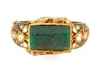 49
A Mughal Style Gold and Gem-Set Bracelet
Centering a rectangular carved emerald accented by fish motifs set with diamond slices, finished with a red, cream and green enamel hinged bangle

Measures: 7 in.
115.0 grams gross
Estimate: $4,000 - $6,000
