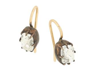 62
A Pair of Antique Silver, Gold and Diamond Earrings
Featuring two antique cushion diamonds weighing approximately 0.98 carats each in a silver claw prong setting finished with 14k gold hooks
2 pieces

Measures: 5/8 x 3/8 in.
1.5 grams gross
Estimate: $2,800 - $3,500