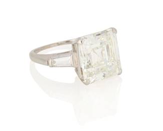 209
A Platinum and Diamond Ring
Centering a square emerald-cut diamond weighing 6.49 carats, flanked by two tapered baguette diamonds

Size: 5
5.7 grams gross

Accompanied by a GIA Report numbered #5232634947, dated July 15, 2025, stating the diamond as Natural with a color grade of I and a clarity grade of VS1, faint fluorescence.
Estimate: $90,000 - $120,000