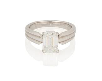 70
Cartier: A Platinum and Diamond ring
Featuring an emerald-cut diamond weighing 2.11 carats, signed Cartier, no. 734546, with original papers

Size: 6
7.6 grams gross

Accompanied by a GIA Report numbered #10059204, dated January 08, 1997, stating the diamond as Natural with a color grade of G and a clarity grade of VS1, fluorescence.
Estimate: $12,000 - $18,000