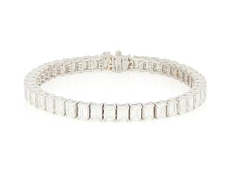 261
A Platinum and Diamond Bracelet
Featuring forty-five emerald-cut diamonds weighing approximately 15.40 carats

Length: 7 in.
35.4 grams gross
Estimate: $15,000 - $20,000