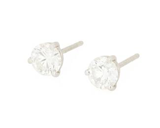 145
A Pair of White Gold, Platinum and Diamond Stud Earrings
Featuring two round diamonds weighing approximately 0.75 carat each
2 pieces

Measures: 1/4 in.
2.72 grams gross

Center Diamond:
Approximate overall color and clarity: G-H, I1-I2
Estimate: $1,500 - $2,500