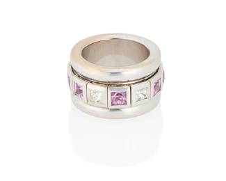 193
An 18K White Gold, Pink Sapphire and Diamond Ring
Featuring a spinning center featuring princess-cut diamonds and pink sapphires

Size: 7 1/2, Width: 5/8 in.
28.4 grams gross
Estimate: $3,500 - $5,500