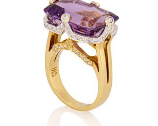 84
An 18K Bi-Color Gold, Amethyst and Diamond Ring
Centering a rectangular mixed-cut amethyst weighing approximately 13.85 carats, accented by round diamonds weighing approximately 0.60 carat

Size: 7 1/4
13.0 grams gross
Estimate: $2,500 - $3,500