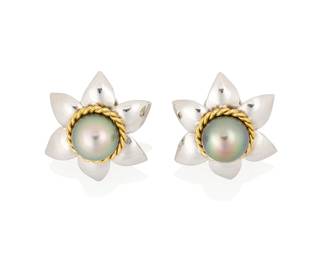 154
A Pair of Bi-Color Gold, and Colored Cultured Pearl Earclips
Of a floral design centering two grey cultured pearl encircled by twisted yellow gold
2 pieces

Measures: 1 x 1 in.
16.9 grams gross
Estimate: $1,000 - $2,000