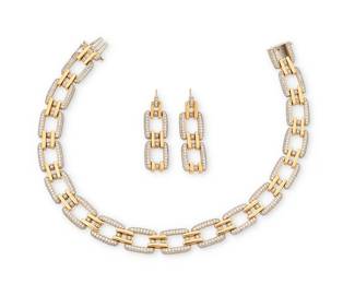 35
A 14K Bi-Color Gold and Diamond Necklace and Earring Set
Featuring white gold rectangular links set with round diamonds weighing approximately 12.73 carats, accented by high polish yellow gold bar connectors
3 pieces

Necklace: 13 1/2 in., Earrings: 2 1/4 x 1/2 in.
121.9 grams gross
Estimate: $10,000 - $15,000