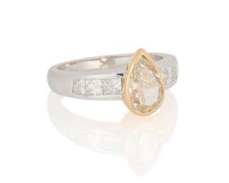 39
An 18K Bi-Color Gold, Colored Diamond and Diamond Ring
Centering a pear-shaped yellow diamond weighing approximately 2.01 carats set in a yellow gold bezel accented by six princess-cut diamonds weighing approximately in a white gold shank 0.76 carats

Size: 7 1/2
7.5 grams gross
Estimate: $2,500 - $3,500