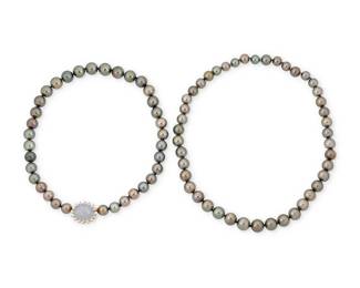 158
A 14K Gold, Colored Cultured Pearl and Star Sapphire Necklace
A long single strand or two strands of graduated black cultured pearls measuring approximately 10.04 -11.85 mm, featuring an enhancer centering an oval star sapphire weighing approximately 20.55 carats encircled by round diamonds weighing approximately 0.80 carats

Length: 34 in. (long) or 14 in. and 20 in., Enhancer: 7/8 x 5/8 in.
144.2 grams gross
Estimate: $8,000 - $12,000