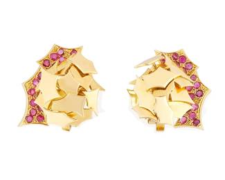 233
A Pair of 18K Gold and Ruby Earclips
Of an angular stacked design set with round rubies
2 pieces

Measures: 1 1/4 x 1 in.
21.0 grams gross
Estimate: $3,000 - $5,000