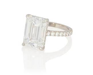 115
A Platinum and Diamond Ring
Featuring an emerald-cut diamond weighing 7.01 carats, accented by round diamonds

Size: 6
6.36 grams gross

Accompanied by a GIA Report numbered #2235151791, dated December 14, 2023, stating the diamond as Natural with a color grade of D and a clarity grade of Flawless, no fluorescence, Excellent polish and Excellent symmetry.
Estimate: $250,000 - $325,000