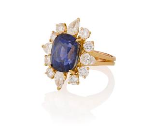 211
An 18K Gold, Sapphire and Diamond Ring
Centering a cushion mixed-cut sapphire weighing 14.21 carats, accented by round and pear-shaped diamonds weighing approximately 3.00 carats

Size: 5 1/2
10.9 grams gross

Accompanied by a AGL Report numbered #1133000, dated August 7, 2023, stating the Sapphire as natural Corundum of Sri Lankan (Ceylon) origin with no clarity enhancements.
Estimate: $55,000 - $75,000