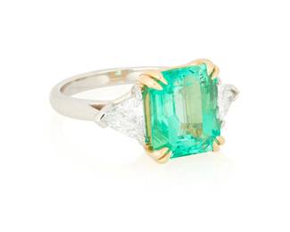 262
An 18K Gold and Platinum, Emerald and Diamond Ring
Centering an octagonal step-cut emerald weighing 4.56 carats, flanked by two triangular-cut diamonds weighing approximately 1.00 carat

Size: 7
8.7 grams gross

Accompanied by a GIA Report numbered #2231400694, dated October 07, 2024, stating the Emerald as natural Beryl of Colombian origin with (F1) clarity enhancement.
Estimate: $10,000 - $15,000