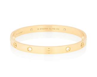 30
Cartier: An 18K Gold and Diamond 'Love' bangle
Featuring four round diamonds weighing approximately 0.40 carat, with two screws, signed Cartier, no. 554DNA, with signed box and papers

Inner circumference: 6 3/4 in., size 18
42.6 grams gross
Estimate: $6,000 - $8,000