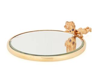 109
Van Cleef & Arpels: A 14K Gold Hand Mirror
Featuring a cherub figure handle finished with round sapphire eyes, signed VCA, no. 13H9-11, with original black case

Measures: 4 x 2 7/8 in.
46.5 grams gross
Estimate: $2,000 - $3,000