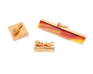 108
Ruser: A 14K Gold Group of Accessories
Including a comb topped with a cupid holding a synthetic ruby heart, a lipstick holder featuring heart-shaped cutouts with a winged cupid figure and a textured gold compact topped with an elf figure finished with round sapphire eyes, all signed Ruser
3 pieces

Comb: 5 1/8 x 1 1/2 in., Lipstick: 2 x 1 in., Compact: 1 5/8 x 1/2 in.
130.8 grams gross
Estimate: $8,000 - $12,000