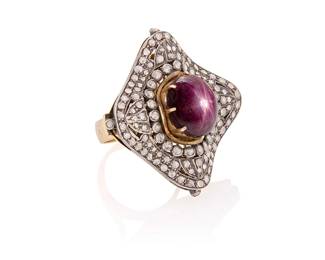 53
A Mughal Style 14K Bi-Color Gold, Star Ruby and Diamond Ring
Centering an oval star ruby cabochon measuring approximately 15.57 x 12.51 mm, accented by rose-cut diamonds set in a concave design

Size: 8 1/4
26.4 grams gross
Estimate: $2,500 - $3,500
