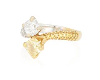 146
An 18K Bi-Color Gold, Fancy Intense Yellow Diamond and Diamond Ring
Of a bypass design featuring a square modified brilliant-cut Fancy Intense Yellow weighing 1.06 carats and a cushion-cut diamond weighing approximately 0.90 carat, accented by round colorless and yellow diamonds

Accompanied by a GIA Report numbered #16331034, dated October 9, 2007, stating the diamond as Natural with a color grade of Fancy Intense Yellow and a clarity grade of VS2, medium blue fluorescence.
Estimate: $4,000 - $6,000