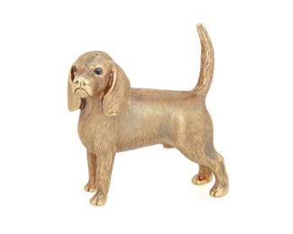 10
Tiffany & Co.: A 14K Gold Dog Brooch
Of a textured gold design finished with two faceted sapphire eyes, signed Tiffany

Measures: 1 1/2 x 1 1/2 in.
33.9 grams gross
Estimate: $3,000 - $5,000