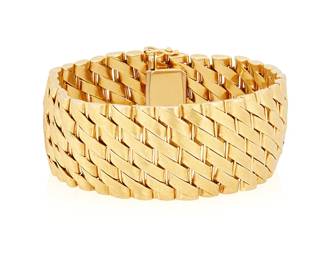 170
Jacques Feuillebois: An 18K Gold Bracelet
Of a satin finish gold woven design, with maker's mark and French assay marks

Length: 7 3/4 in., Width: 1 in.
90.3 grams gross
Estimate: $10,000 - $15,000