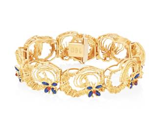 232
UnoAerre: An 18K Gold and Enamel Bracelet
Featuring swirling textured links of gold accented by flowers of red and blue enamel, signed UnoAerre

Measures: 7 1/2 in.
51.9 grams gross
Estimate: $2,200 - $2,800