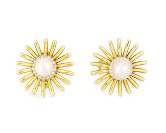 8
A Pair of 14K Gold, Cultured Pearl, and Diamond Earclips
Centering two cultured pearls measuring approximately 9.60 mm, encircled by round diamonds set in a starburst design
2 pieces

Measures: 1 1/4 in.
26.7 grams gross
Estimate: $1,800 - $2,500